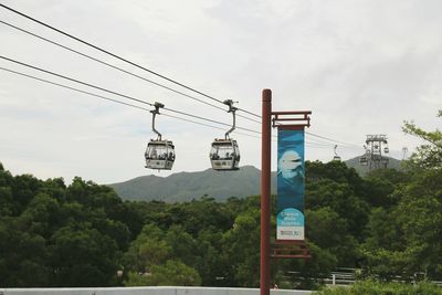 Low angle view of communications tower against sky