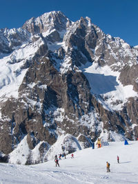 Scenic view of snowcapped mountain against sky