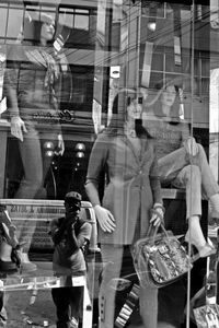 Rear view of man holding woman at store