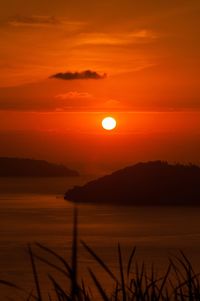 Scenic view of sea against romantic sky at sunset