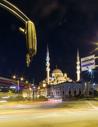 Light trails on street leading towards blue mosque