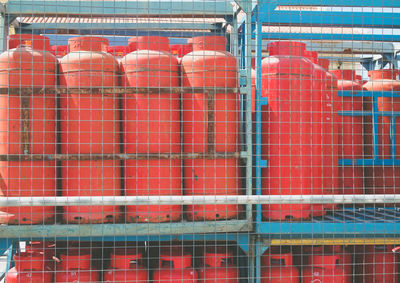 Close up of red gas bottles