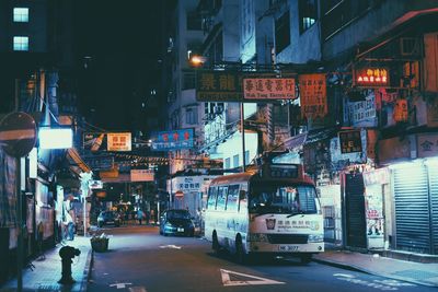 Illuminated city street at night