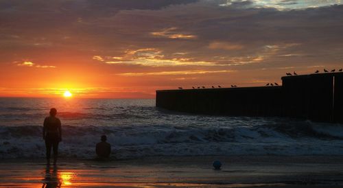 Scenic view of sea at sunset