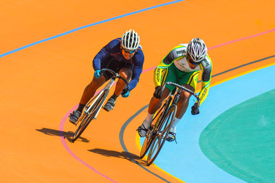 High angle view of people riding bicycle