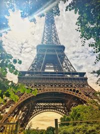 Low angle view of tower against cloudy sky