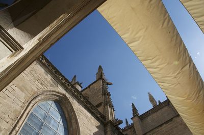 Low angle view of historical building against blue sky