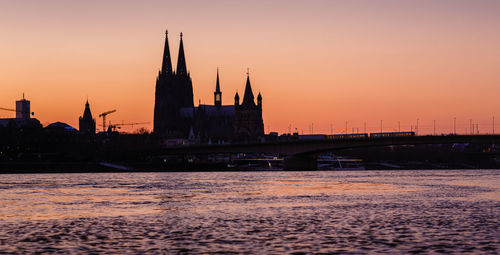 View of bridge over river against sky during sunset