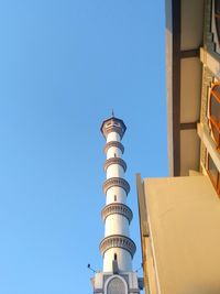 Low angle view of building against blue sky