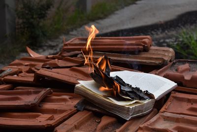 Book burning on roof tiles