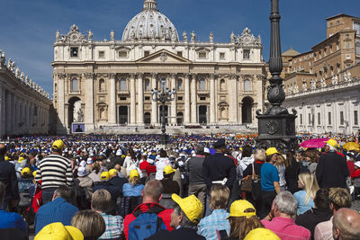 Crowd at st peters square against basilica