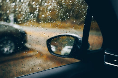 Reflection of car on side-view mirror