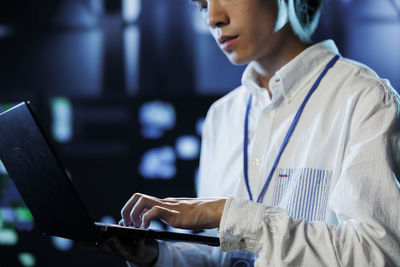 Young woman using laptop at home