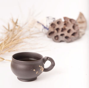 Close-up of coffee cup on table