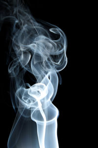 Close-up of smoke against black background