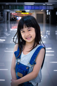 Portrait of girl standing at shopping mall