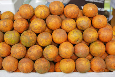 Close-up of oranges for sale at market stall