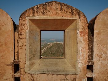 View of hill from stone window