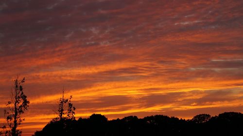 Low angle view of dramatic sky at sunset