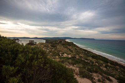 Scenic view of bay against sky