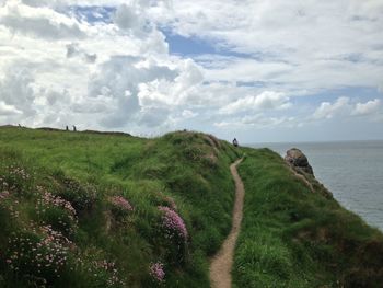 Scenic view of sea against cloudy sky