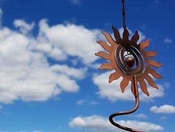 Low angle view of metal against sky