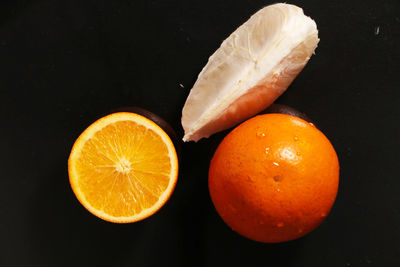 Orange and grapefruit on the table