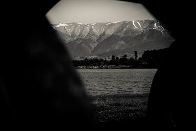 Scenic view of lake against mountain range