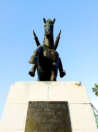 Low angle view of statue against clear sky