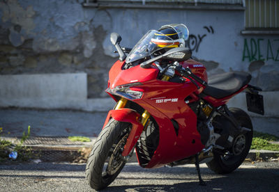 Motorcycle ducati parked on street in city