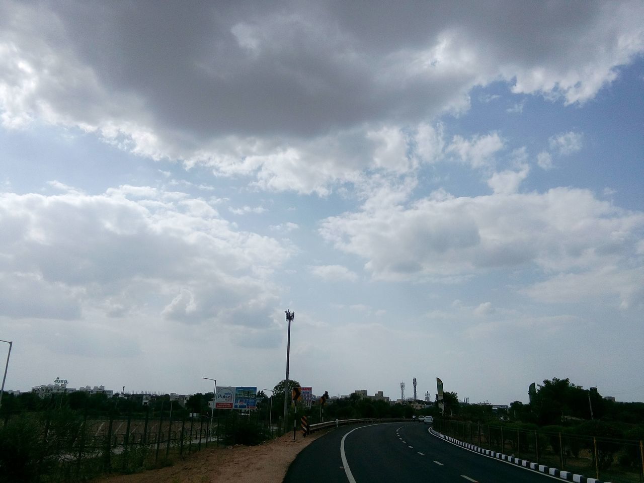 Sky and clouds ,trees ,road ,tower ,summer,afternoon