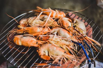 High angle view of meat on barbecue grill