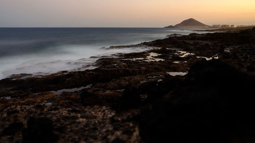 Scenic view of sea against sky during sunset