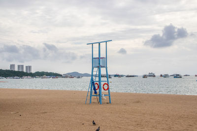 Lifeguard high chair on a beach or coast directly on a tourist vacation spot