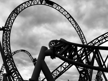 Low angle view of rollercoaster against sky