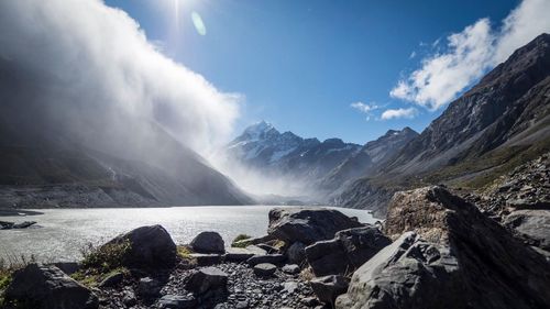 Scenic view of lake against rocky mountains