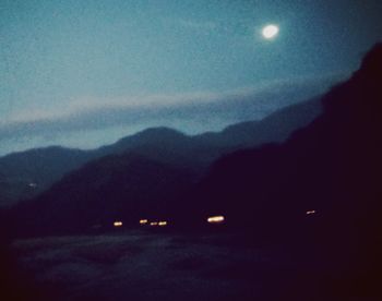 Scenic view of landscape against sky at dusk