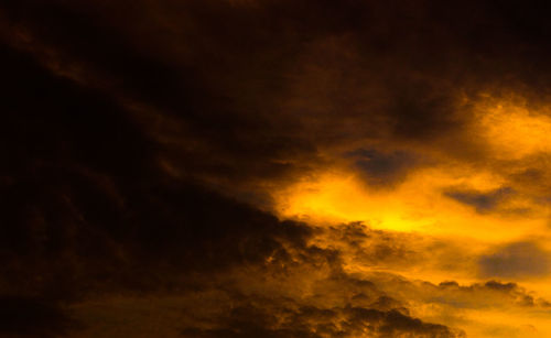 Low angle view of dramatic sky at sunset