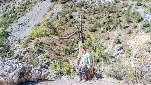 Rear view of woman walking on mountain
