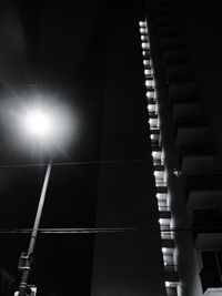 Low angle view of illuminated building against sky