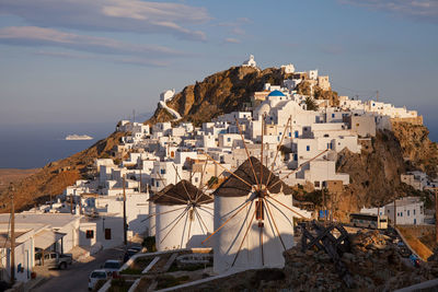 High angle view of townscape by sea against sky