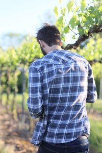 Rear view of man standing on field