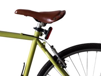 Cropped image of bicycle over white background