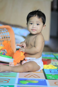 Cute baby boy playing