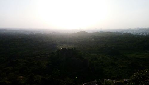 Scenic view of mountains against cloudy sky