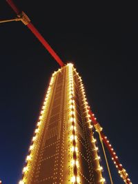 Low angle view of illuminated building at night