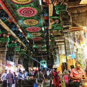 People at illuminated temple