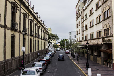 Road along buildings in city