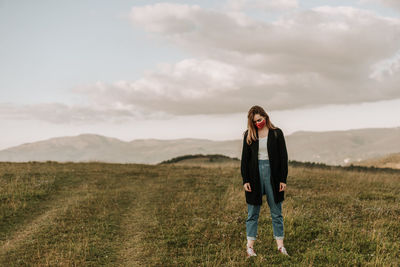 Sad woman with mask outdoors