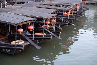 Boats moored in lake